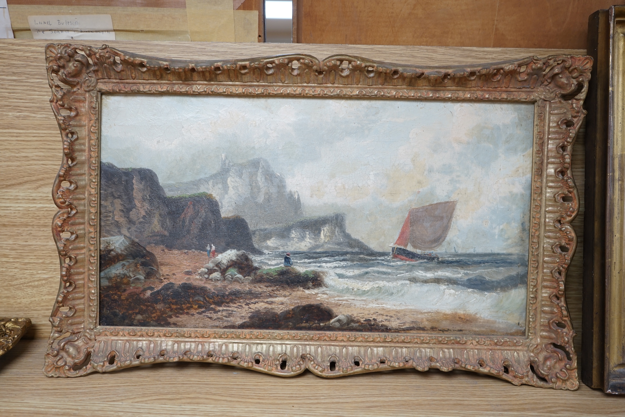 Late 19th / early 20th century School, oil on canvas, Coastal scene with figures, unsigned, 24 x 44cm. Condition - fair, craquelure throughout